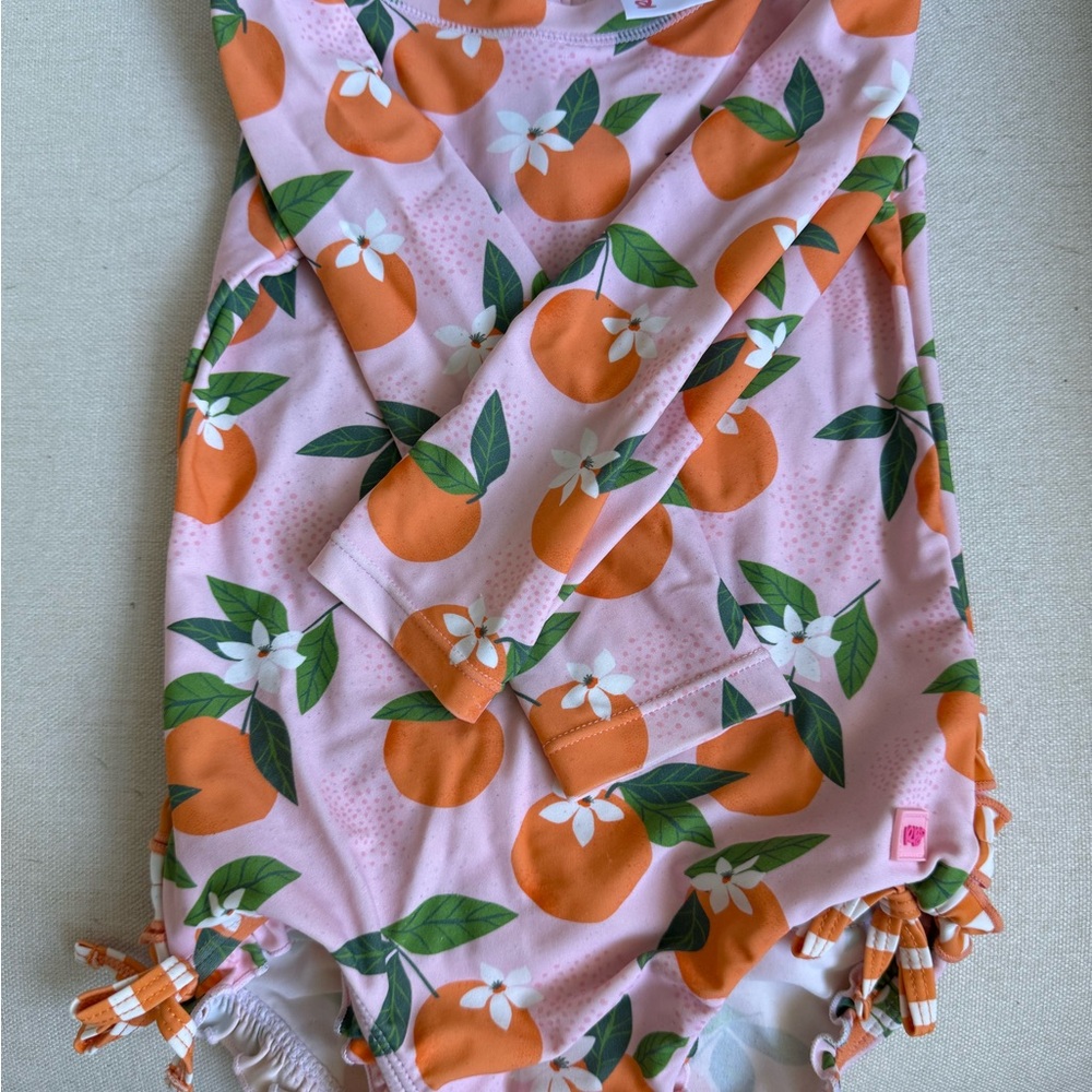 Ruffle butts orange long sleeve one piece rash guard 2T